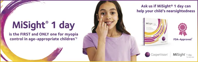 A young girl putting in a contact lens